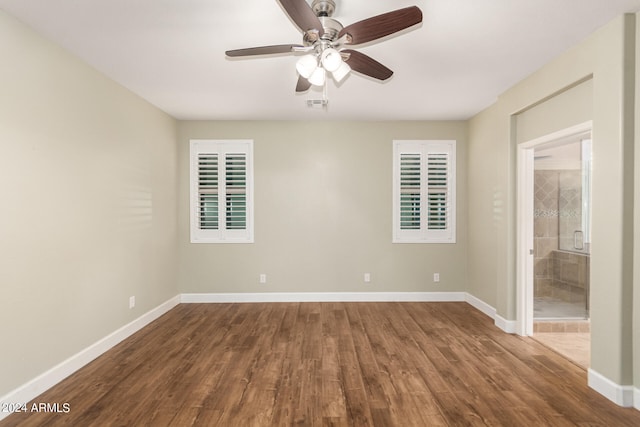 spare room featuring ceiling fan and hardwood / wood-style floors