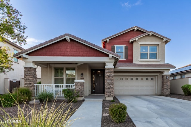 craftsman-style home featuring a garage and covered porch