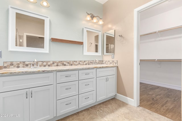 bathroom with hardwood / wood-style floors and vanity