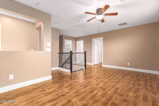 spare room featuring ceiling fan and wood-type flooring