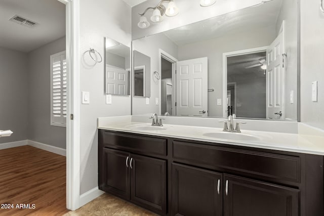 bathroom with hardwood / wood-style flooring and vanity