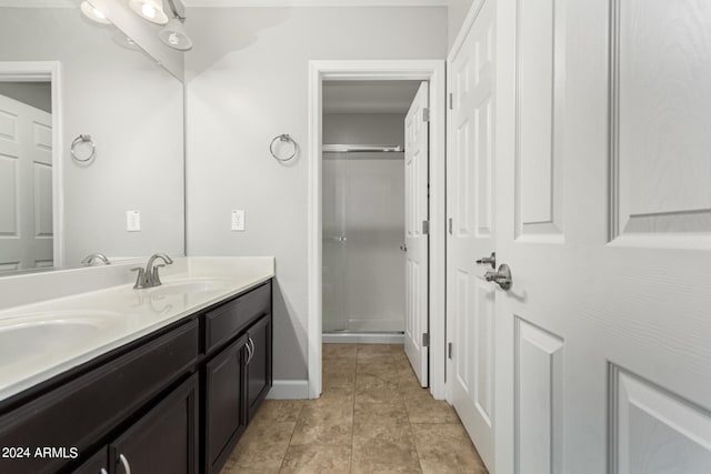 bathroom featuring tile patterned flooring and vanity