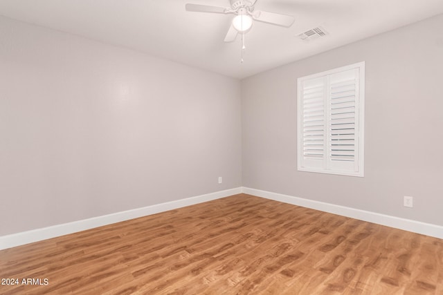 empty room featuring ceiling fan and wood-type flooring