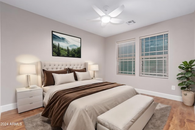 bedroom with ceiling fan and light hardwood / wood-style flooring