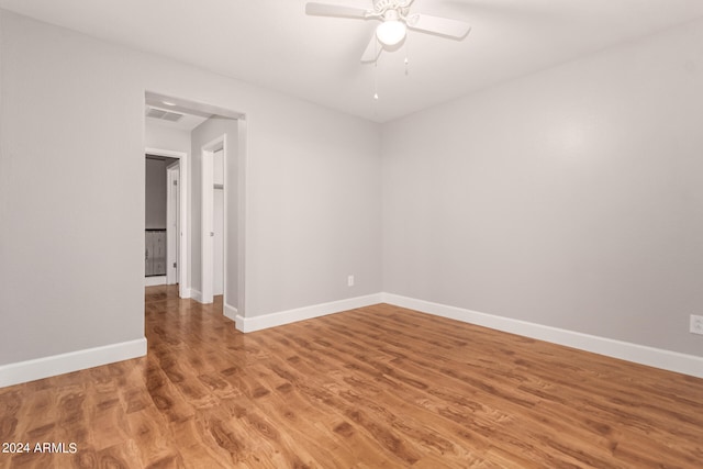 spare room featuring ceiling fan and wood-type flooring