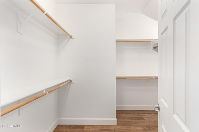 walk in closet featuring hardwood / wood-style floors