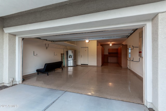 garage featuring stainless steel fridge