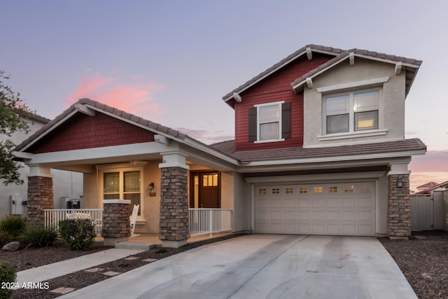 craftsman-style home featuring a garage and a porch