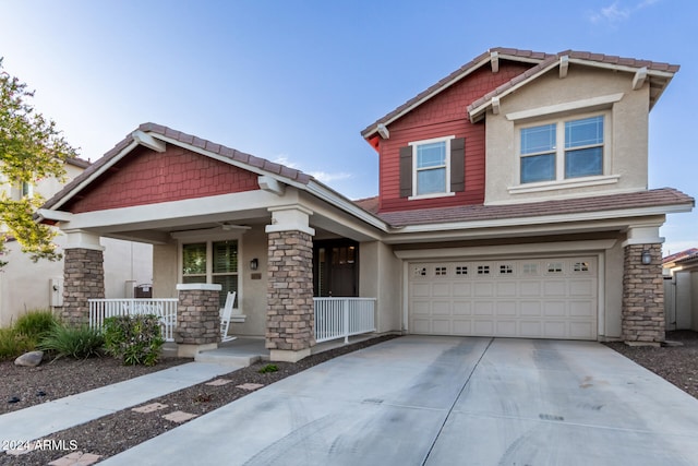 craftsman inspired home featuring a porch and a garage