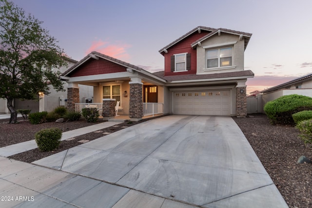 craftsman-style home featuring a garage and covered porch