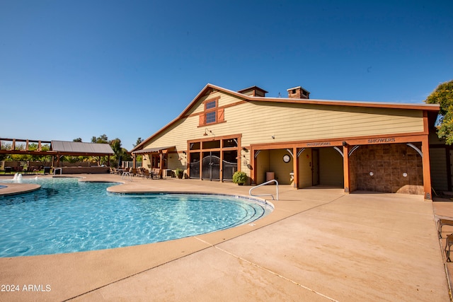 view of pool featuring a patio