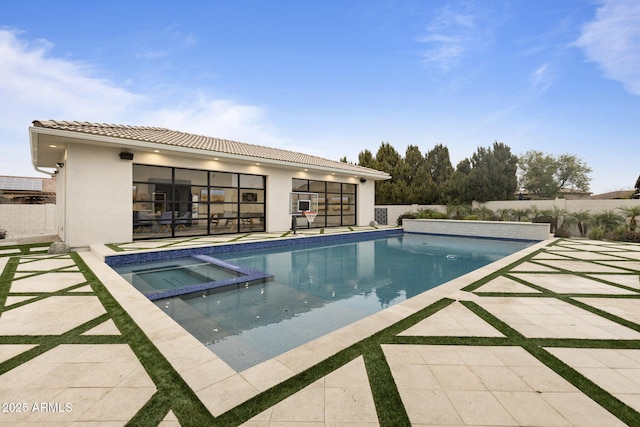 view of swimming pool with an in ground hot tub and a patio area