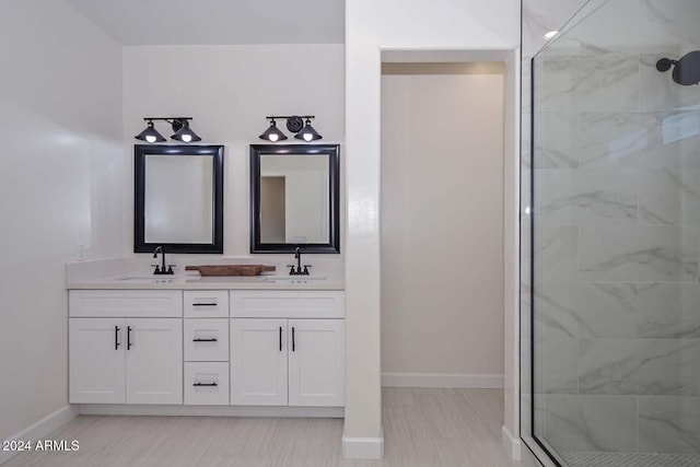 bathroom featuring vanity and a shower with shower door