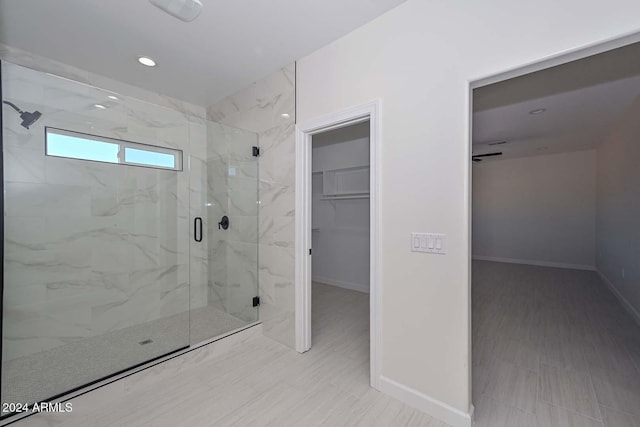 bathroom featuring an enclosed shower