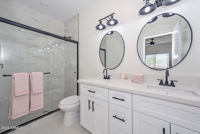 bathroom featuring walk in shower, vanity, toilet, and ceiling fan