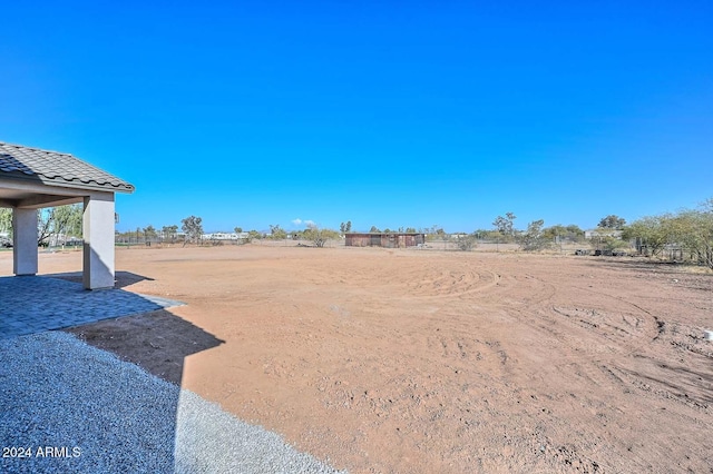 view of yard with a rural view