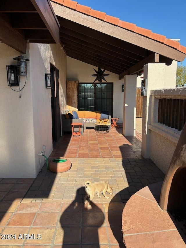 view of patio featuring ceiling fan and outdoor lounge area