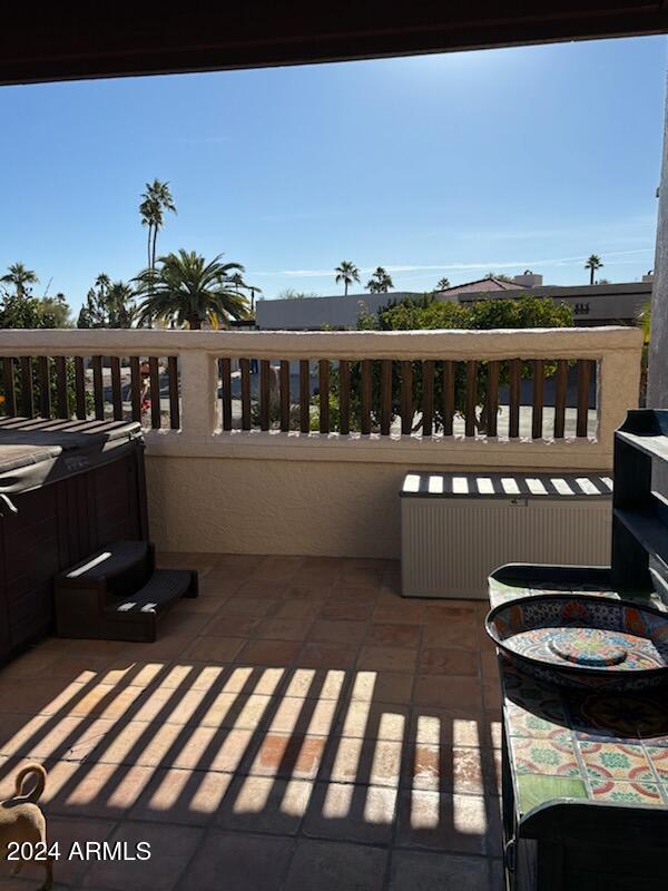 balcony with radiator and a hot tub