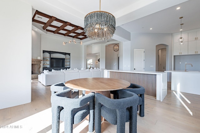 11328 E Dreyfus Ave, Scottsdale, AZ 85259 - dining room featuring coffered ceiling, light wood-type flooring, arched walkways, recessed lighting, and beam ceiling