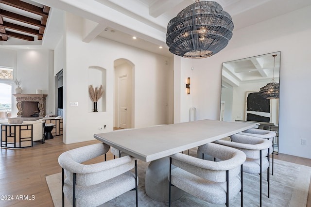 11328 E Dreyfus Ave, Scottsdale, AZ 85259 - dining area featuring beamed ceiling, arched walkways, coffered ceiling, light wood finished floors, and recessed lighting