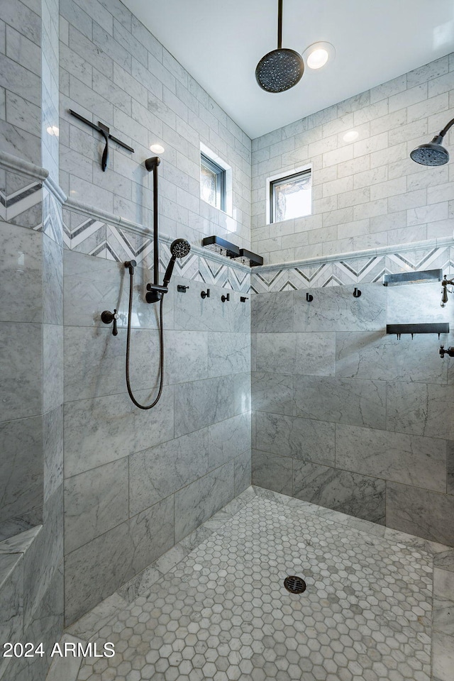 bathroom with tiled shower