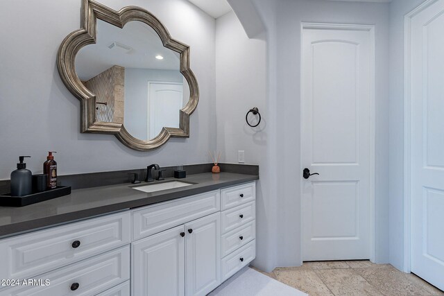 11328 E Dreyfus Ave, Scottsdale, AZ 85259 - bathroom featuring vanity and stone finish flooring