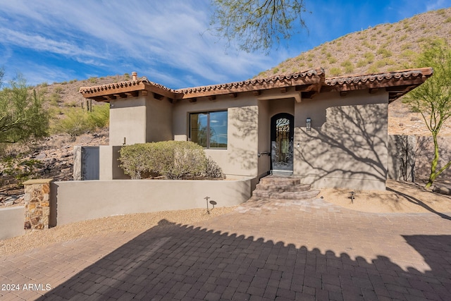 11328 E Dreyfus Ave, Scottsdale, AZ 85259 - view of front facade featuring stucco siding, a tile roof, and a mountain view