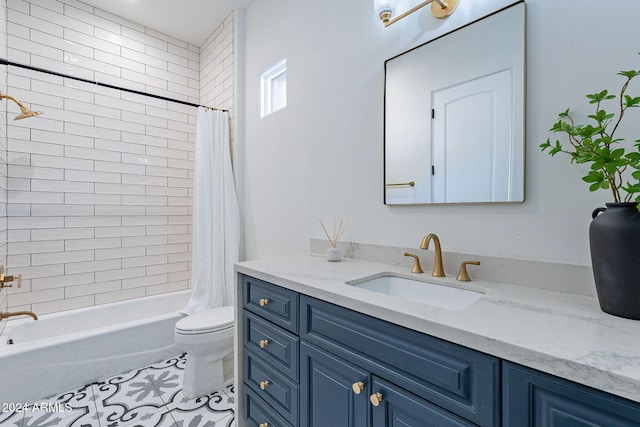 full bathroom with tile patterned floors, shower / bath combo with shower curtain, vanity, and toilet