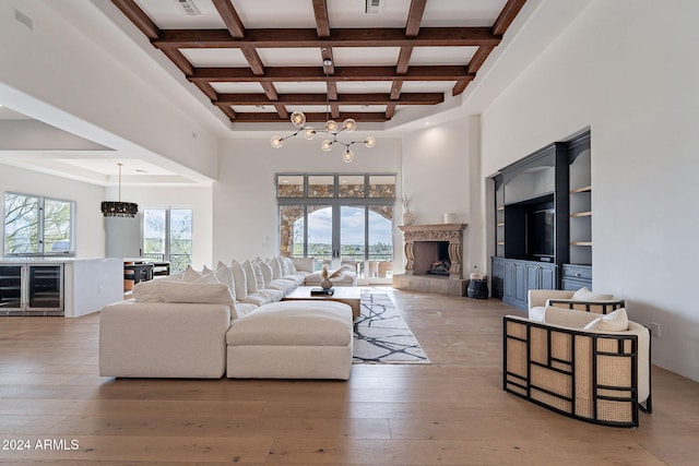 11328 E Dreyfus Ave, Scottsdale, AZ 85259 - living room with a chandelier, beverage cooler, beam ceiling, coffered ceiling, and a high ceiling