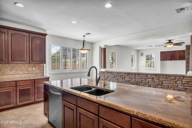 1755 E Tonto Dr, Chandler, AZ 85249 - kitchen with stainless steel dishwasher, decorative backsplash, light stone counters, recessed lighting, and pendant lighting
