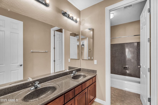 1755 E Tonto Dr, Chandler, AZ 85249 - bathroom with double vanity, tile patterned floors, and shower / bath combination