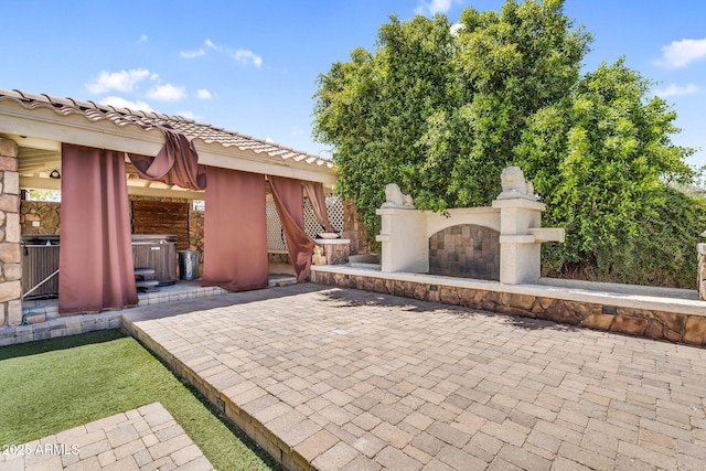 1755 E Tonto Dr, Chandler, AZ 85249 - view of patio with exterior fireplace, a hot tub, and a gazebo