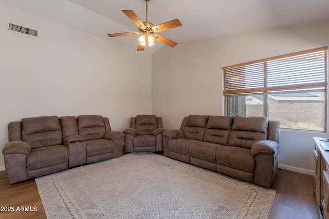 15128 W Melissa Ln, Surprise, AZ 85374 - living area with wood finished floors, a ceiling fan, lofted ceiling, and baseboards