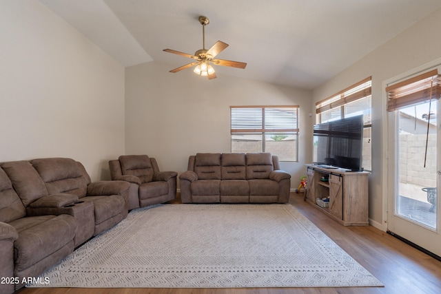 15128 W Melissa Ln, Surprise, AZ 85374 - living room with a ceiling fan, vaulted ceiling, light wood-style flooring, and baseboards