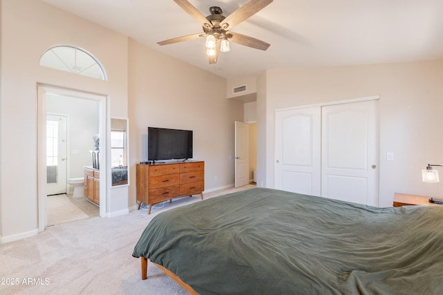 15128 W Melissa Ln, Surprise, AZ 85374 - bedroom featuring vaulted ceiling, a closet, light colored carpet, baseboards, and ceiling fan