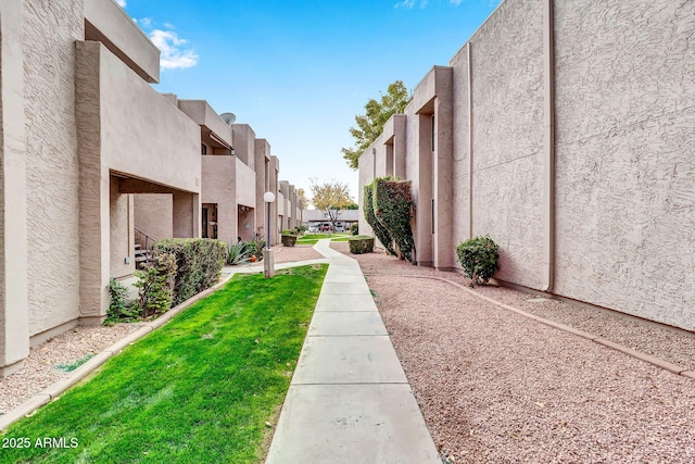 view of property's community with a lawn