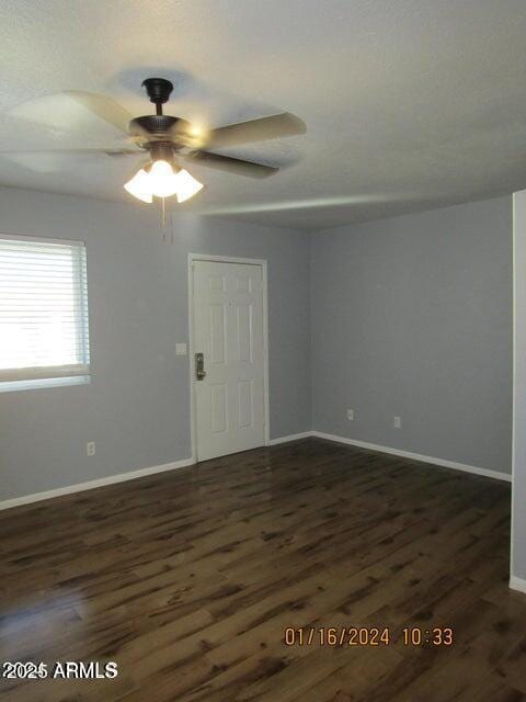 21622 N 23rd Ave Unit B 304, Phoenix, AZ 85027 - spare room with dark wood finished floors, baseboards, and a ceiling fan