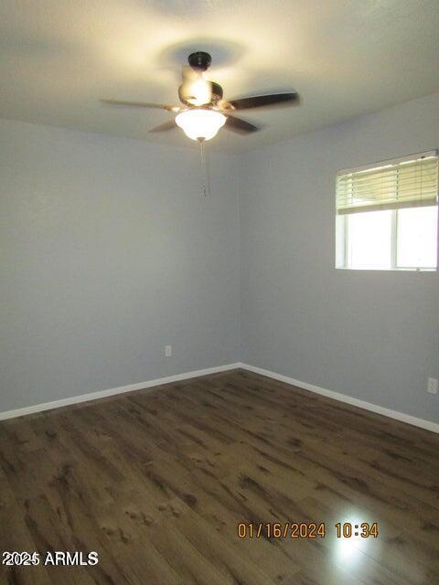 21622 N 23rd Ave Unit B 304, Phoenix, AZ 85027 - unfurnished room with wood finished floors, baseboards, and ceiling fan
