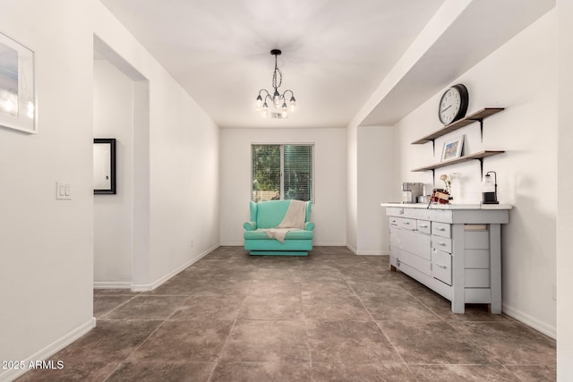 120 E Concorda Dr, Tempe, AZ 85282 - unfurnished room with a chandelier, bar area, and baseboards