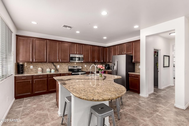 120 E Concorda Dr, Tempe, AZ 85282 - kitchen with a sink, visible vents, tasteful backsplash, and appliances with stainless steel finishes