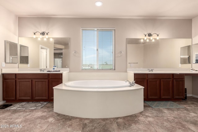 120 E Concorda Dr, Tempe, AZ 85282 - bathroom featuring a sink, a bath, and two vanities