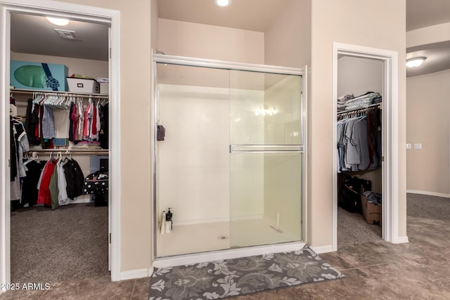 120 E Concorda Dr, Tempe, AZ 85282 - full bathroom featuring visible vents, a spacious closet, a stall shower, and baseboards