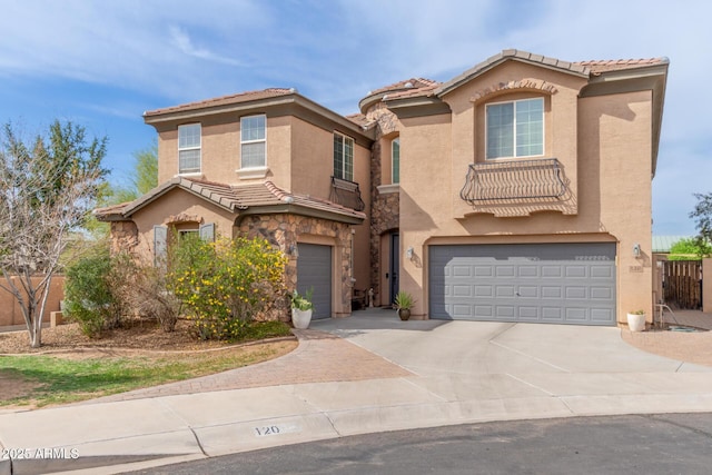 120 E Concorda Dr, Tempe, AZ 85282 - mediterranean / spanish-style home featuring a tiled roof, stone siding, a garage, stucco siding, and driveway