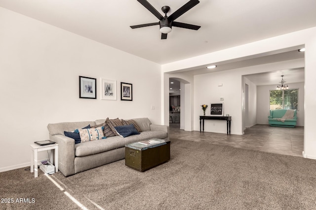120 E Concorda Dr, Tempe, AZ 85282 - living area featuring arched walkways, carpet, ceiling fan with notable chandelier, and baseboards