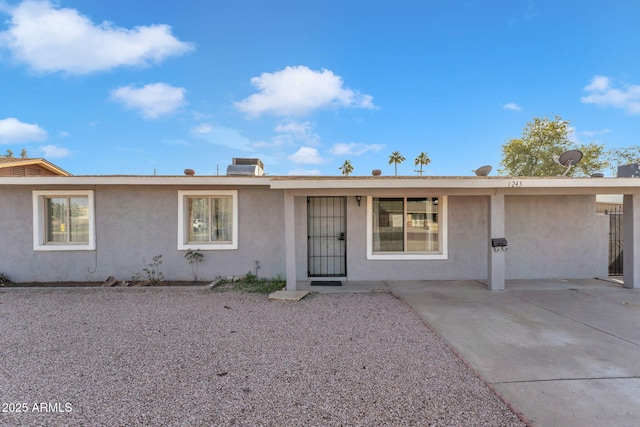 single story home with stucco siding