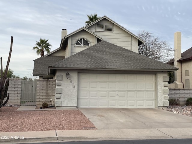 view of front of property with a garage