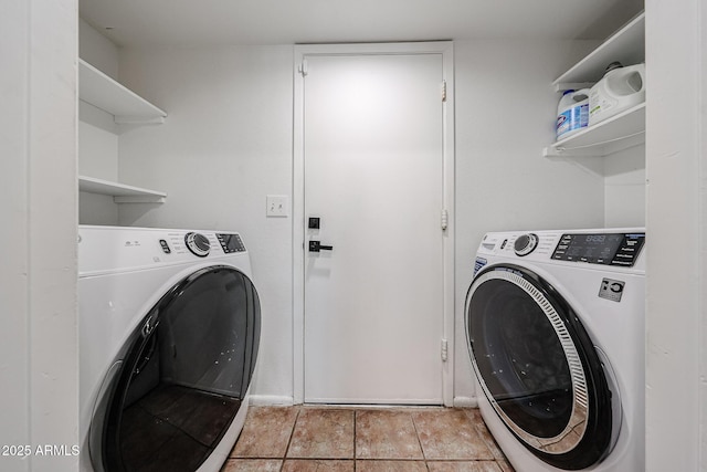 clothes washing area featuring independent washer and dryer