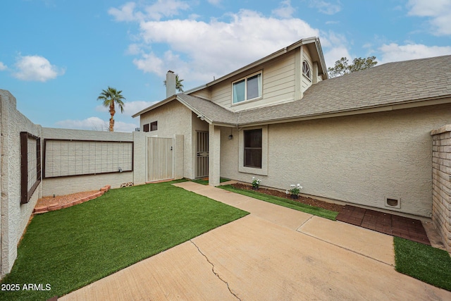 exterior space featuring a yard and a patio area