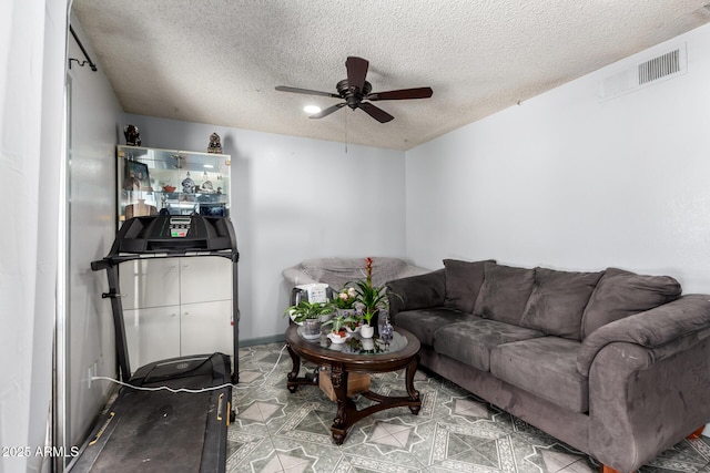 5432 W Sunnyside Dr, Glendale, AZ 85304 - living area featuring ceiling fan and a textured ceiling