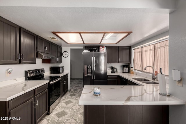 5432 W Sunnyside Dr, Glendale, AZ 85304 - kitchen with stainless steel fridge, electric stove, under cabinet range hood, black microwave, and a peninsula